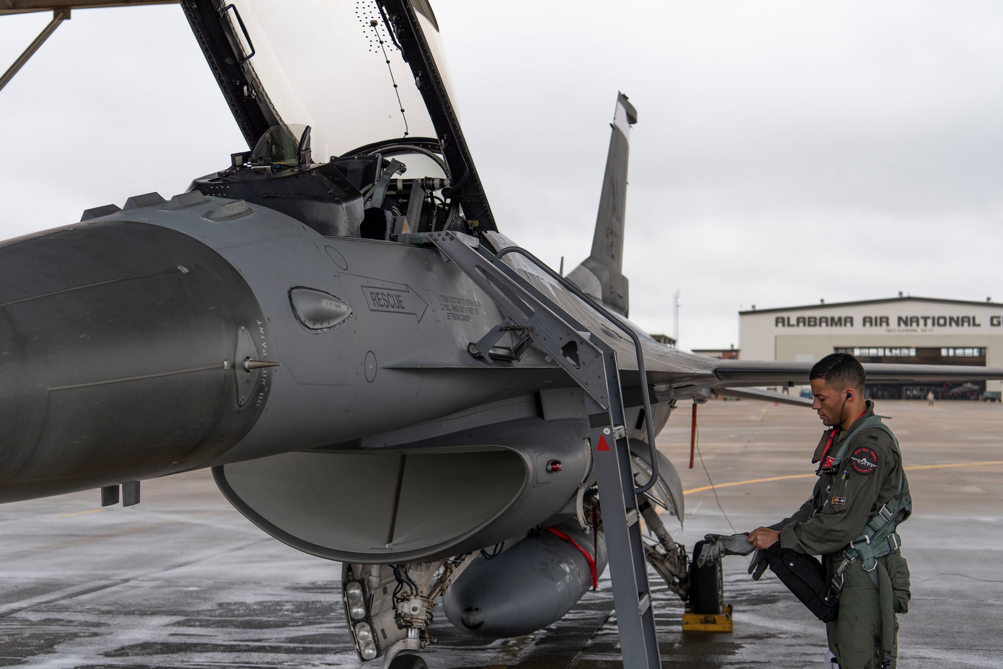 Photo of 1st Lt. Lucas Brown, F-16 pilot with the 377th Fighter Squadron, preparing to fly.