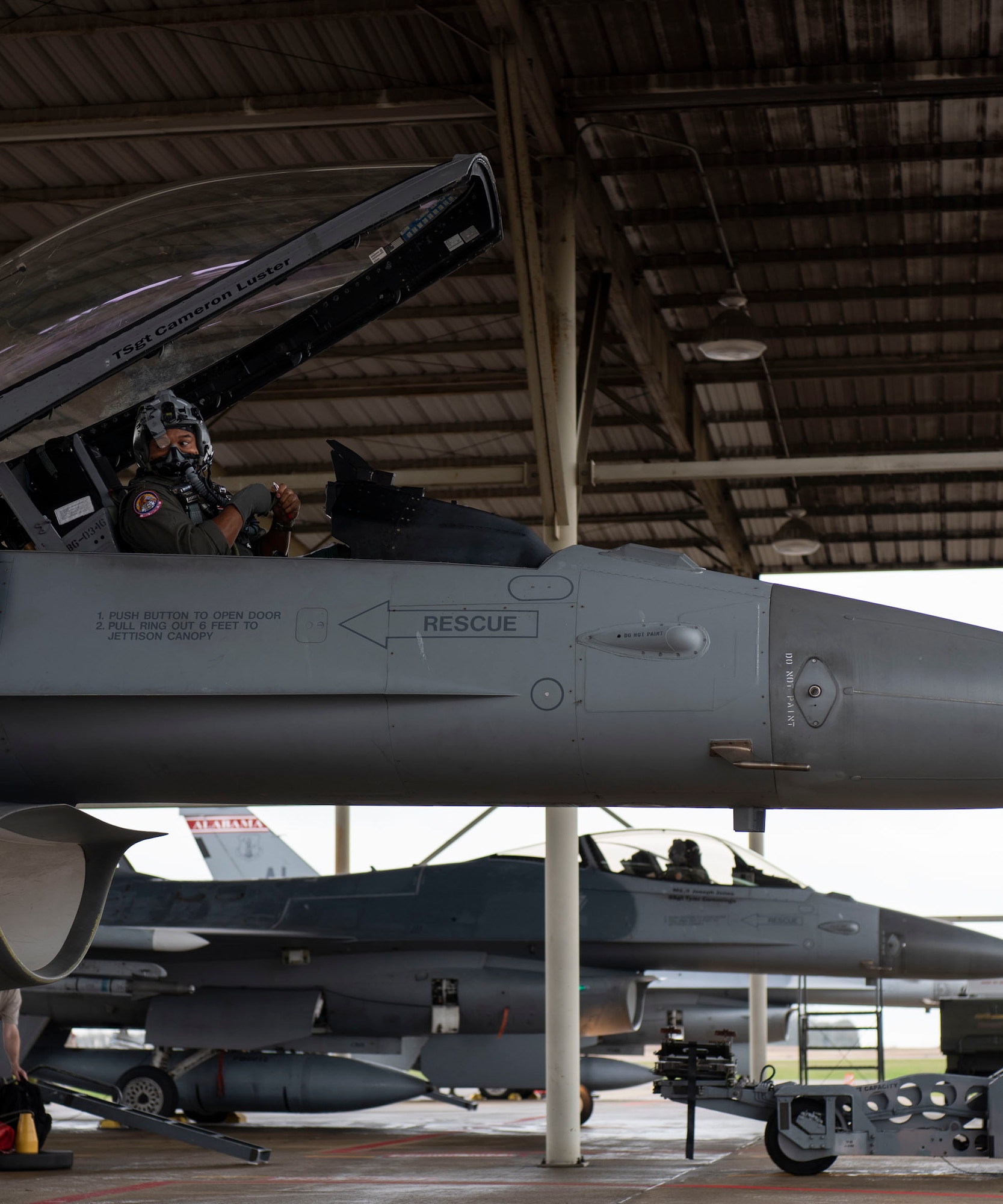Photo of Maj. Rich Peace, F-16 pilot with the 100th Fighter Squadron, preparing to fly.