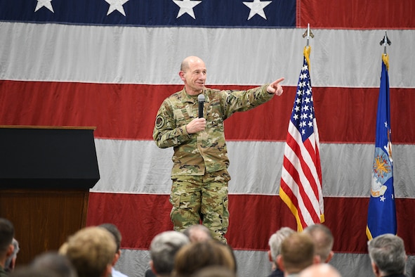 Gen. Mike Holmes, commander of Air Combat Command, points during his F-35A “full warfighting capability” ceremony presentation.