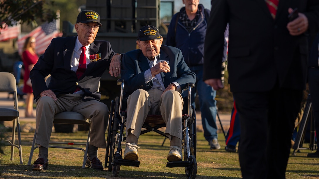 Iwo Jima U.S. Navy veteran Mort Block, at right, observes the 75th Commemoration of the Battle of Iwo Jima sunset ceremony at Marine Corps Base Camp Pendleton, California, Feb. 15, 2020. Twenty-eight Iwo Jima veterans attended the event, which is the final commemoration ceremony scheduled by the Iwo Jima Commemorative Committee and included a wreath laying, 21-gun artillery salute, a remembrance for the fallen with “Taps”, and a traditional cake-cutting ceremony featuring the oldest and youngest Marines present. (U.S. Marine Corps photo by Cpl. Rachel Mendieta)