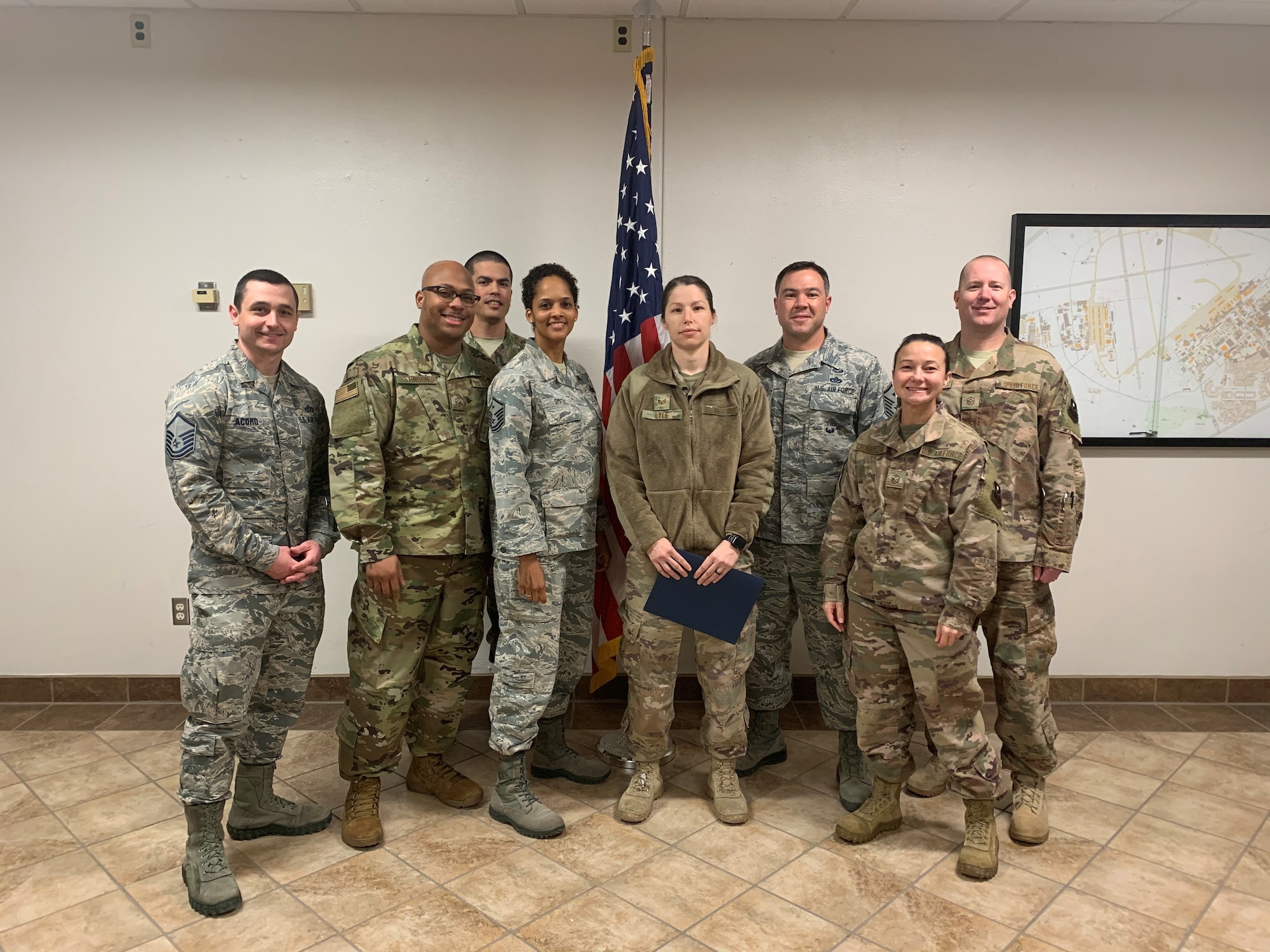 Staff Sgt. Tabitha Lyle, 49th Security Forces Squadron military working dog handler, and members of Holloman First Sergeants pose for a photo, Feb. 20, 2020, on Holloman Air Force Base, N.M. Every month, a first sergeant has the honor of choosing a deserving Airman to be presented the Diamond Sharp Award for an outstanding act or continuous outstanding performance. (Courtesy photo)