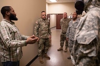 Brooks Price, assigned to the Joint Task Force Civil Support (JTF-CS) Chemical, Biological, Radiolgical, and Nuclear Cell, briefs U.S. Army North Command Senior Enlisted Leader (CSEL) Command Sgt. Maj. Alberto Delgado, on the command’s commercial off-the-shelf personal protective equipment.