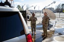 Air Force Master Sgt. Lakisha DeJesus, assigned to the Joint Task Force Civil Support (JTF-CS) J6 directorate briefs U.S. Army North Command Senior Enlisted Leader Command Sgt. Maj. Alberto Delgado on the command’s emergency response vehicle and it’s capabilities.