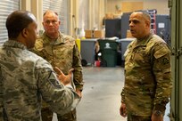 U.S. Army North Command Senior Enlisted Leader (CSEL) Command Sgt. Maj. Alberto Delgado (right) speaks with Air Force Master Sgt. Edward Johnson and Joint Task Force Civil Support (JTF-CS) CSEL Chief Master Sgt. James Brown in the command’s mobility center.
