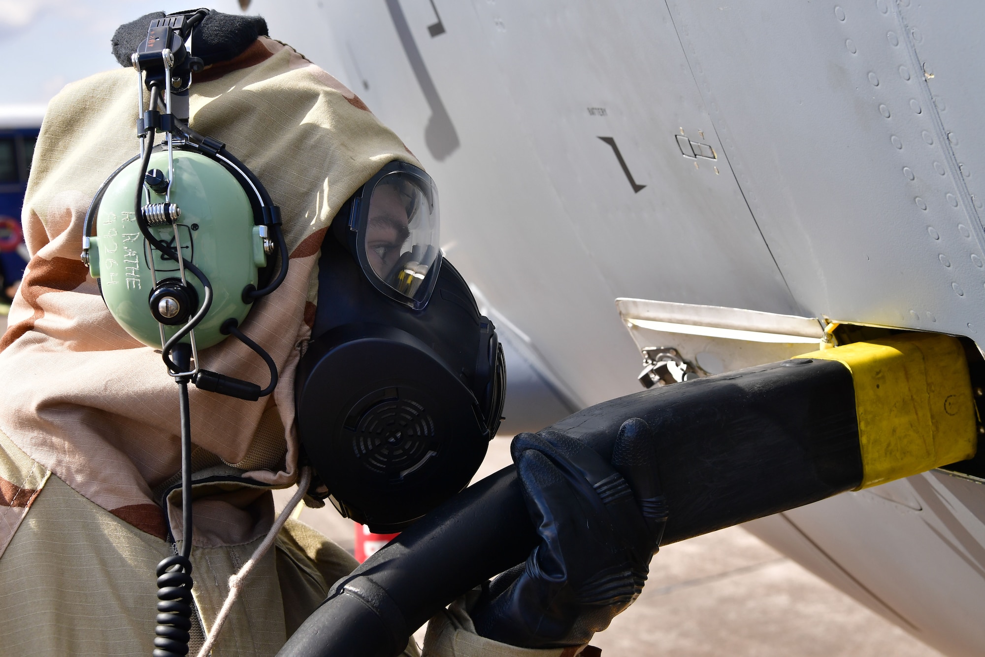 An Airman from the 19th Aircraft Maintenance Squadron connects power to a C-130J Super Hercules.