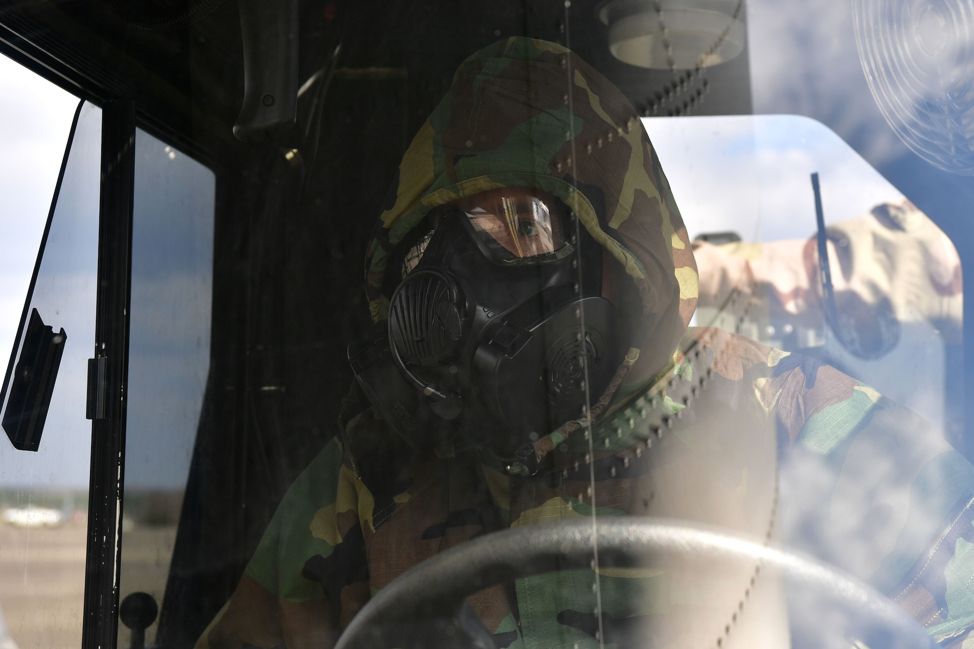 An Airman from the 19th Logistic Readiness Squadron drives a K loader to the back of C-130J Super Hercules.
