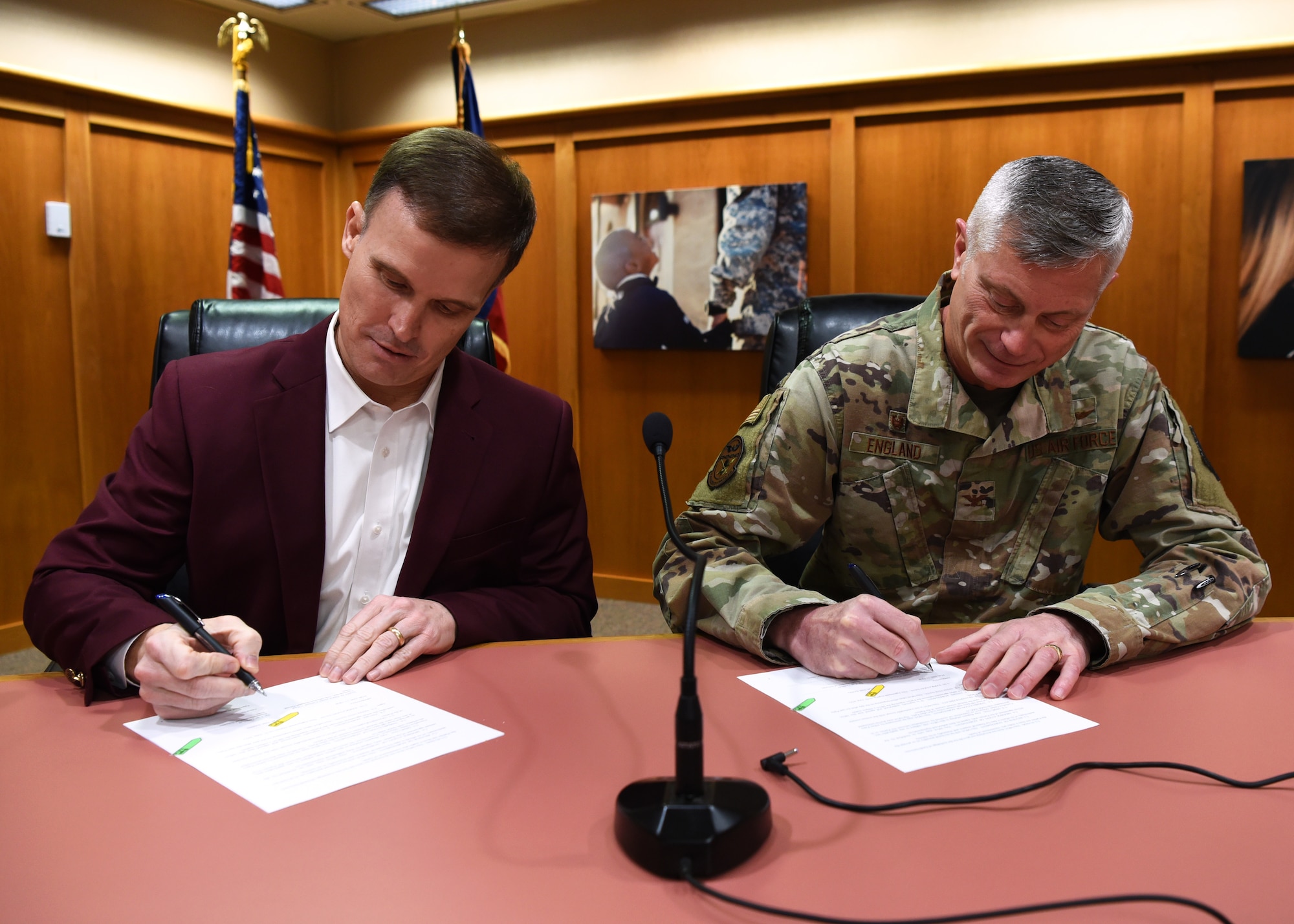 Superintendent of Schools Dr. Carl Dethloff and U.S. Air Force Col. Tony England, 17th Mission Support Group commander, sign a memorandum of agreement, manifesting the 17th Training Wing to provide vehicle mechanics and technicians with SAISD in exchange for SAISD to provide transportation, inside the SAISD Administration Building, in San Angelo, Texas, Feb. 21, 2020. Two years in the making, the MOA was reached as part of the Goodfellow Community Partnership Initiate, which enhances trust and support between GAFB and the local community through partnership opportunities. (U.S. Air Force photo by Airman 1st Class Abbey Rieves)
