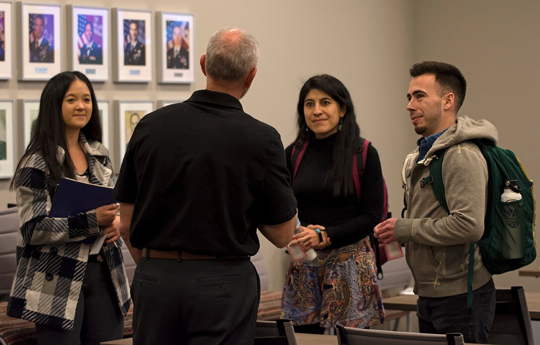 University of New Mexico students speak with Reginald Bourgeois, USACE-Albuquerque District STEM outreach coordinator, during a STEM outreach event hosted by the U.S. Army Corps of Engineers-Albuquerque District at the USACE-Albuquerque District headquarters office, Feb. 20, 2020. Bourgeois was discussing his experiences with the USACE National Power Team in Puerto Rico after Hurricane Maria.