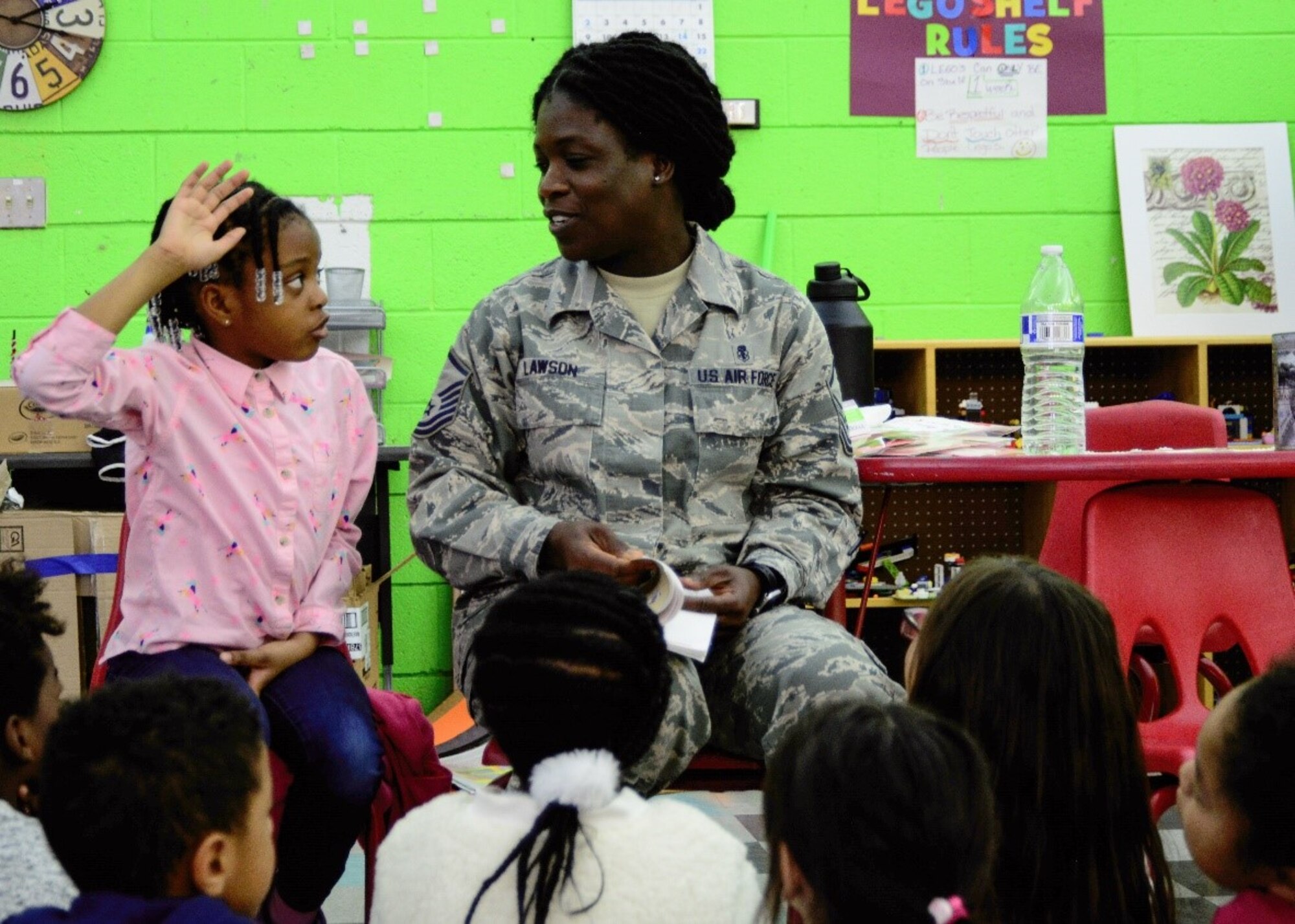 A Master Sgt. answers a question during an event at the Kirtland Youth Center.