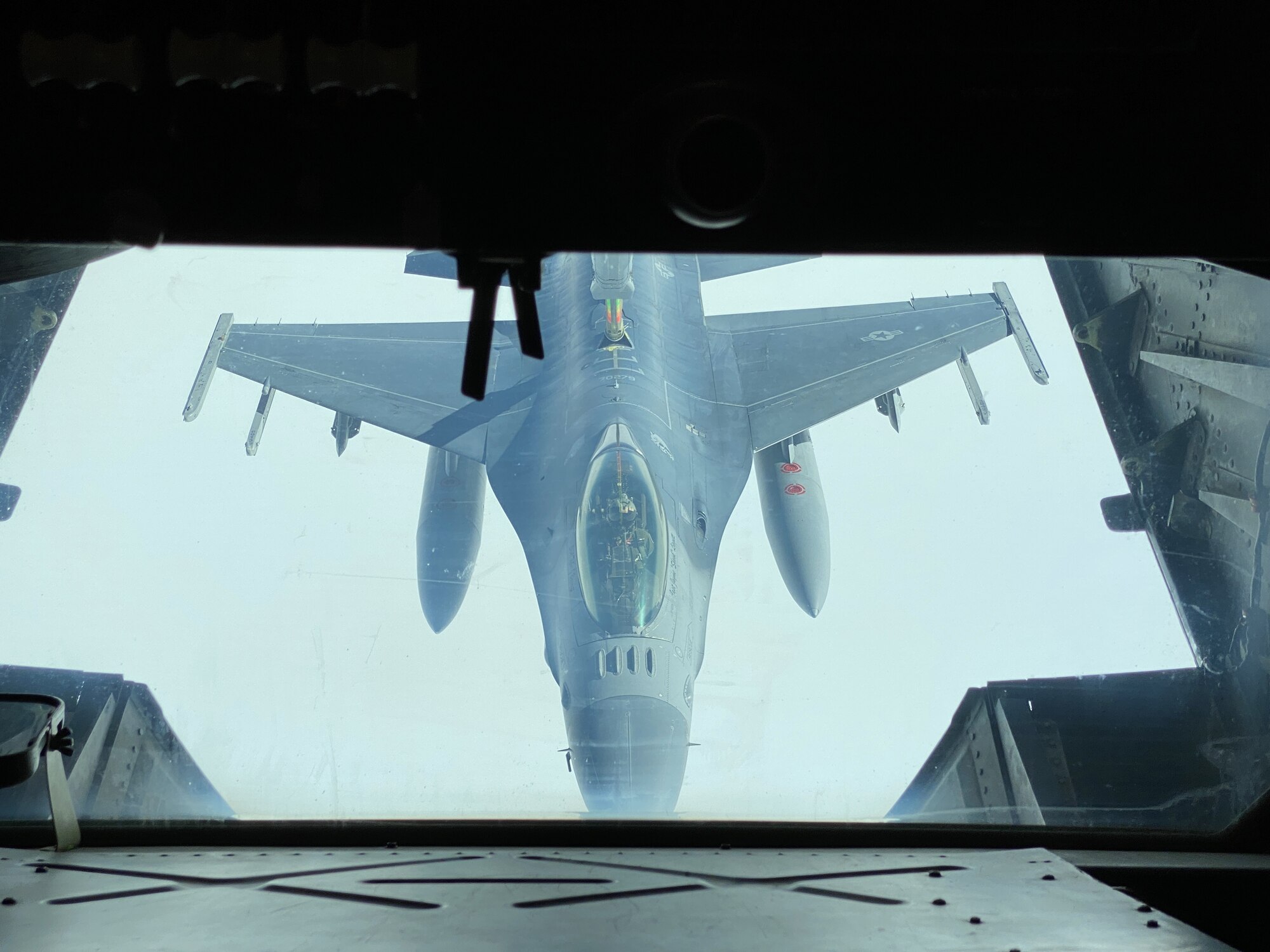 An F-16 Fighting Falcon refuels behind a KC-10 Extender
