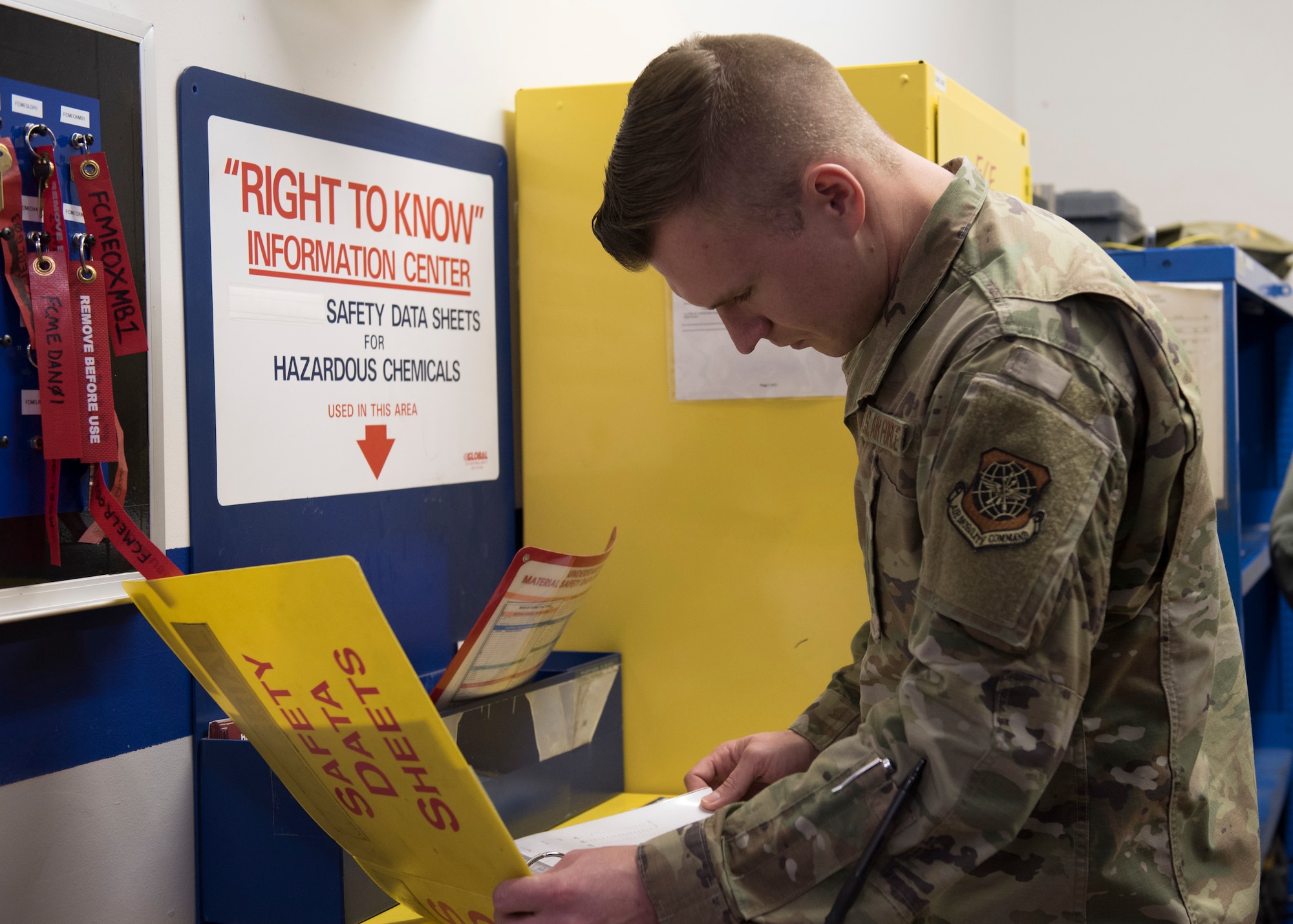 Staff Sgt. Ants Vahk, 92nd Medical Group Bioenvironmental Engineering technician, reviews an aircraft electrical and oxygen shop safety manual during an annual health risk assessment at Fairchild Air Force Base, Washington, Feb. 3, 2020. Bioenvironmental Airmen complete annual health risk assessments by sharing a comprehensive report on their possible exposures, risks and compliance to safety standards. Unit commanders use the advisory report to consider how best to balance mission success and taking care of Airmen.  (U.S. Air Force photo by Staff Sgt. Ryan Lackey)