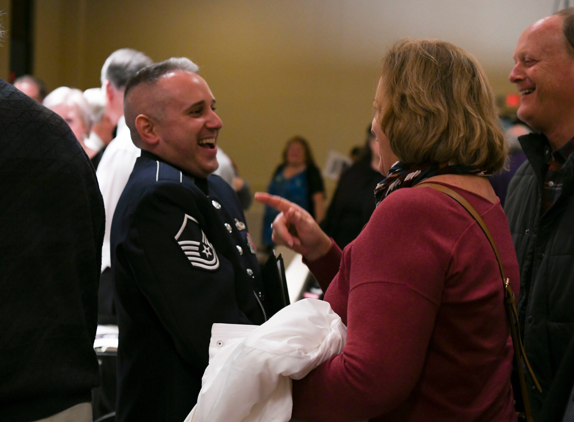 Master Sgt. Joseph Haughton, U.S. Air Force Band Singing Sergeants tenor, engages with concert guests after a performance in San Diego, Ca., Feb. 17, 2020. Air Force Band members act as musical ambassadors, displaying the professionalism and high standards they are held to. (U.S. Air Force photo by Airman 1st Class Spencer Slocum)