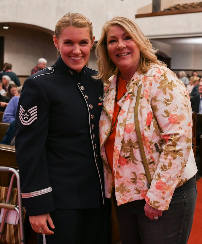 Tech. Sgt. Nadia Sosnoski, U.S. Air Force Band Singing Sergeants soprano, poses for a photo with her mother in La Jolla, Ca., Feb. 11, 2020. The concert was the first time Sosnoski was able to see her mother since returning from a 102-day deployment to Al Udeid Air Base, Qatar which took her to eight countries. (U.S. Air Force photo by Airman 1st Class Spencer Slocum)