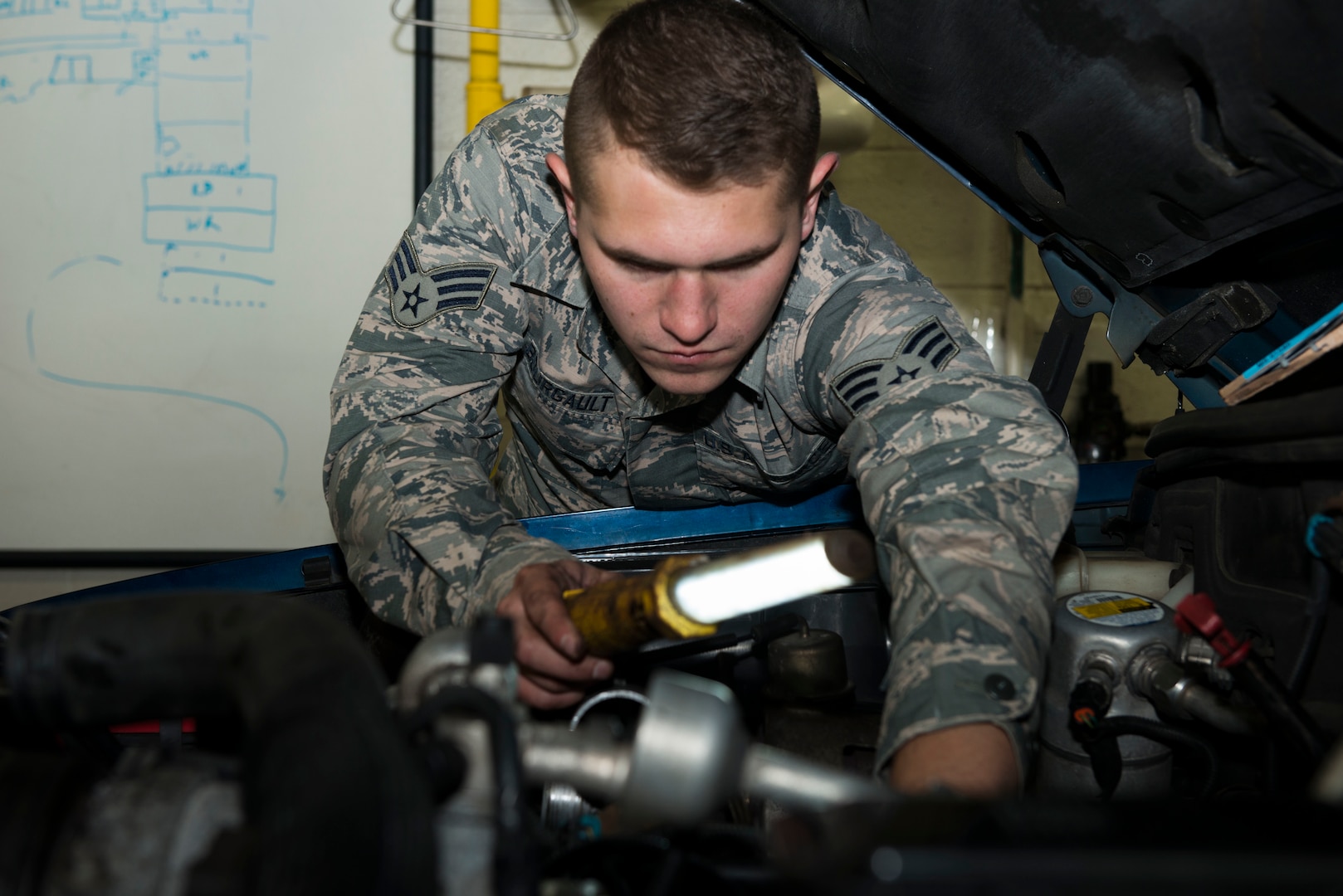 Senior Airman Thomas Bourgault, 103rd Logistics Readiness Squadron vehicle maintenance journeyman, checks under the hood of a pickup truck at Bradley Air National Guard Base, East Granby, Conn. Nov. 3, 2019. Vehicle maintenance specialists perform scheduled maintenance and necessary repairs to Bradley’s entire fleet of vehicles, ensuring readiness of organizations throughout the installation, including aircraft maintenance and fire and emergency services. (U.S. Air National Guard photo by Senior Airman Sadie Hewes)