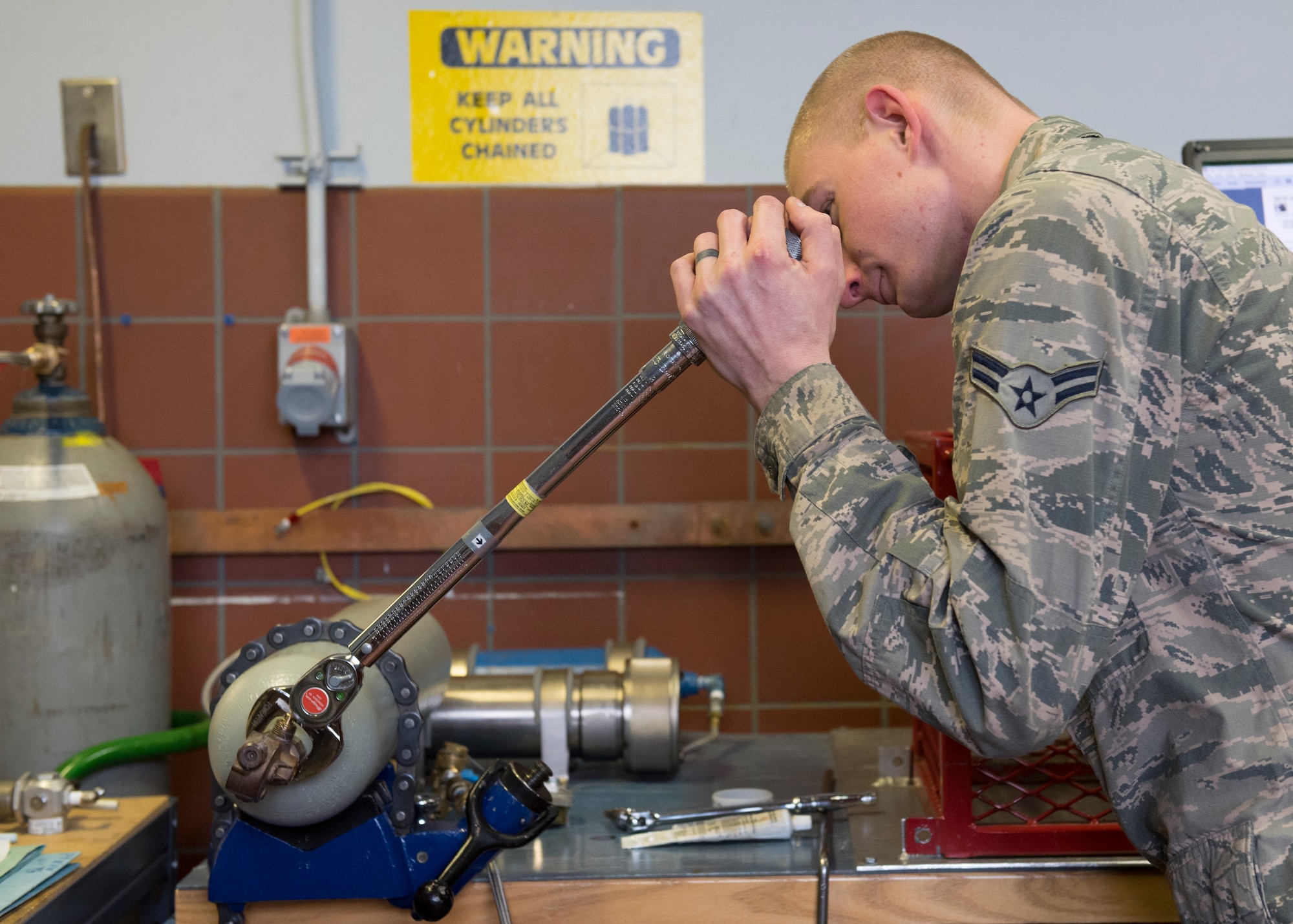 A 92nd Maintenance Squadron aircraft electrical and oxygen shop Airman displays oxygen bottle handling procedures during an annual health risk assessment at Fairchild Air Force Base, Washington, Feb. 3, 2020. Safety may always be an Air Force priority, but accidents may still occur, as there are some tasks that have a higher degree of injury risk no matter how well you prepare or try to make safe. (U.S. Air Force photo by Staff Sgt. Ryan Lackey)
