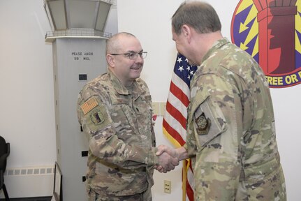 New Hampshire Air National Guard Col. Mark Ustaszewski, 157th Operations Group, right, congratulates Lt. Col. Charles Smith, 260th Air Traffic Control Squadron commander, after pinning the U.S. Air Force Bronze Star Medal on Smith during a ceremony at Pease Air National Guard Base, N.H., Feb. 9, 2020. Smith was awarded the Bronze Star Medal for his meritorious achievement as Commander, 44rd Air Expeditionary Squadron, Al Asad Air Base, Iraq, while engaged in operations against an opposing armed force from 2 April 2019 through 6 October 2019. (U.S. Air National Guard photo by Tech. Sgt. Aaron Vezeau)