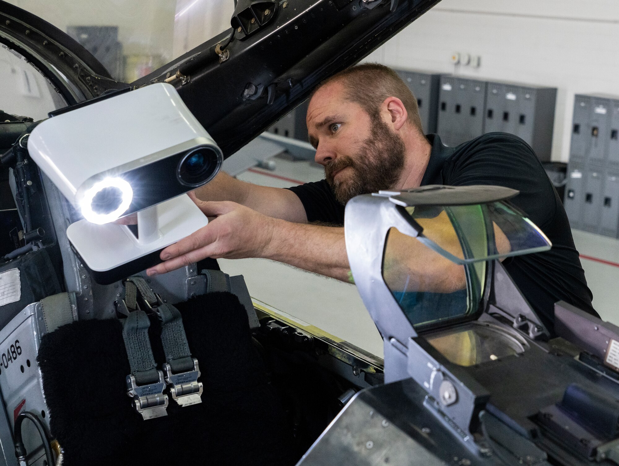 person 3D scanning an F-16