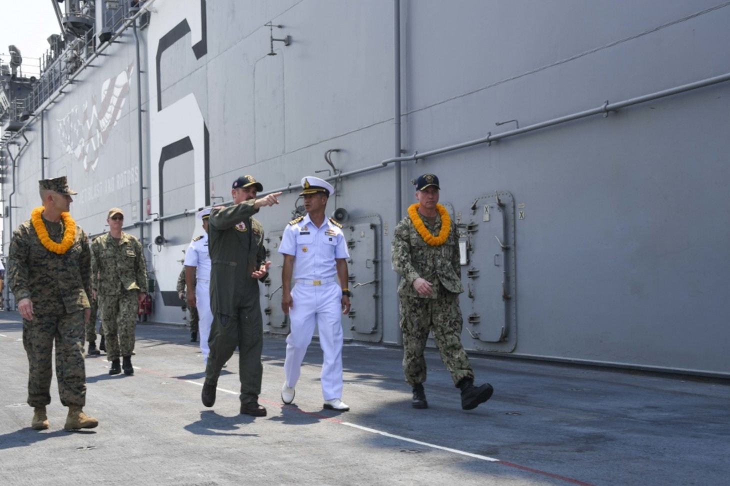 LAEM CHABANG, Thailand (Feb. 22, 2020) Cmdr. Stephen Audelo, air boss, guides Commander, Amphibious Task Force, Royal Thai Navy Capt. Arpa Chapanon on a tour of the flight deck aboard amphibious assault ship USS America (LHA 6) during a reception for the 31st MEU and America before the start of Exercise Cobra Gold 2020 (CG 20). The America Expeditionary Strike Group-31st MEU team will participate in CG 20, the largest theater security cooperation exercise in the Indo-Pacific region and an integral part of the U.S. commitment to strengthen engagement in the region.