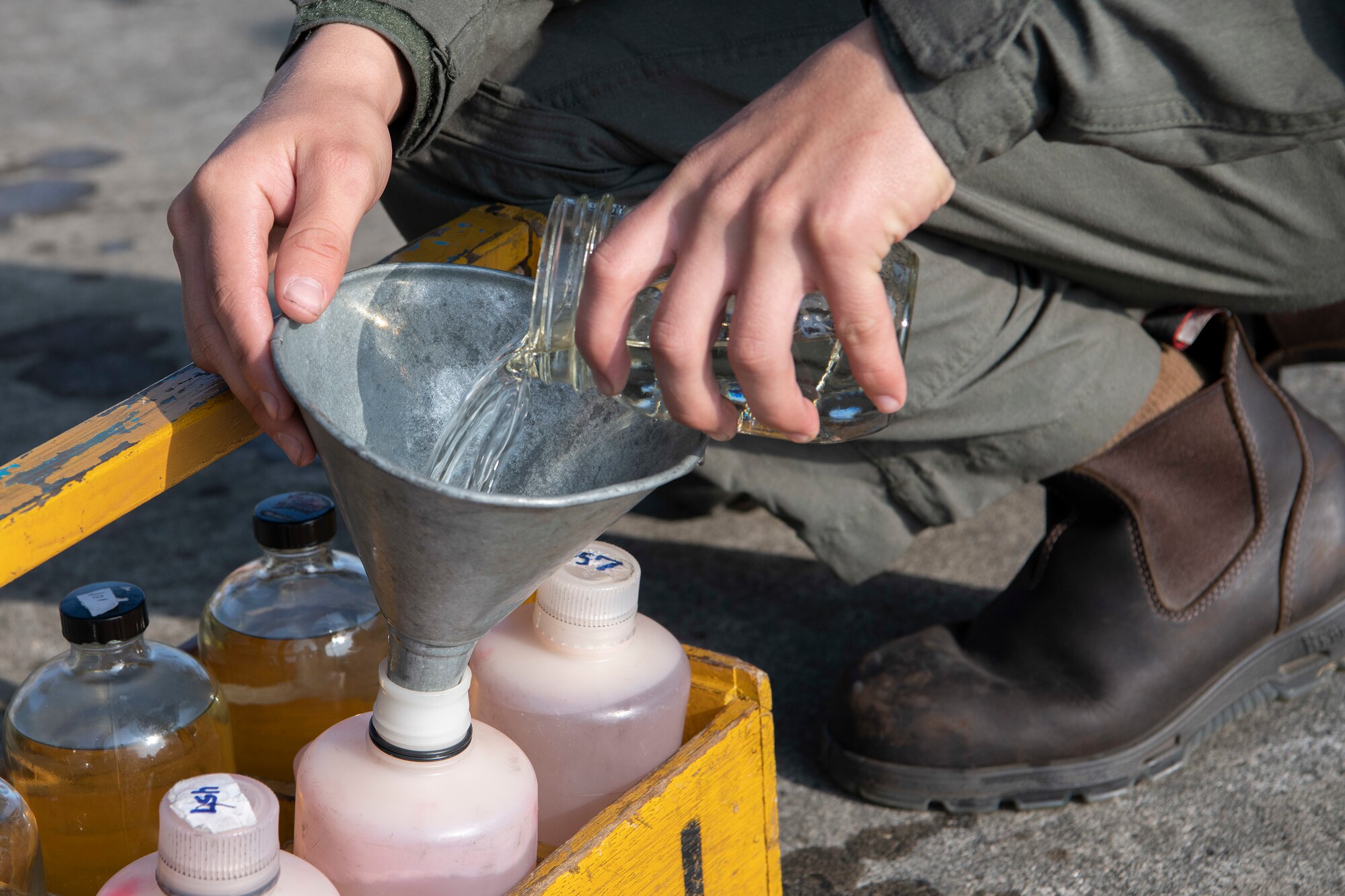 U.S. Marine Lance Cpl. Noah Gulledge, Marine Corps Air Station Futenma semi refueler, gathers fuel from a U.S. Air Force C-130J Super Hercules for testing during an Agile Combat Employment exercise Feb. 21, 2020, at Marine Corps Air Station Futenma, Japan. Exercises that test our multi-capable Airmen and joint partners to provide munition loading and tactical refueling with minimal support are integral to employing precise ACE concept practices. (U.S. Air Force photo by Senior Airman Rhett Isbell)