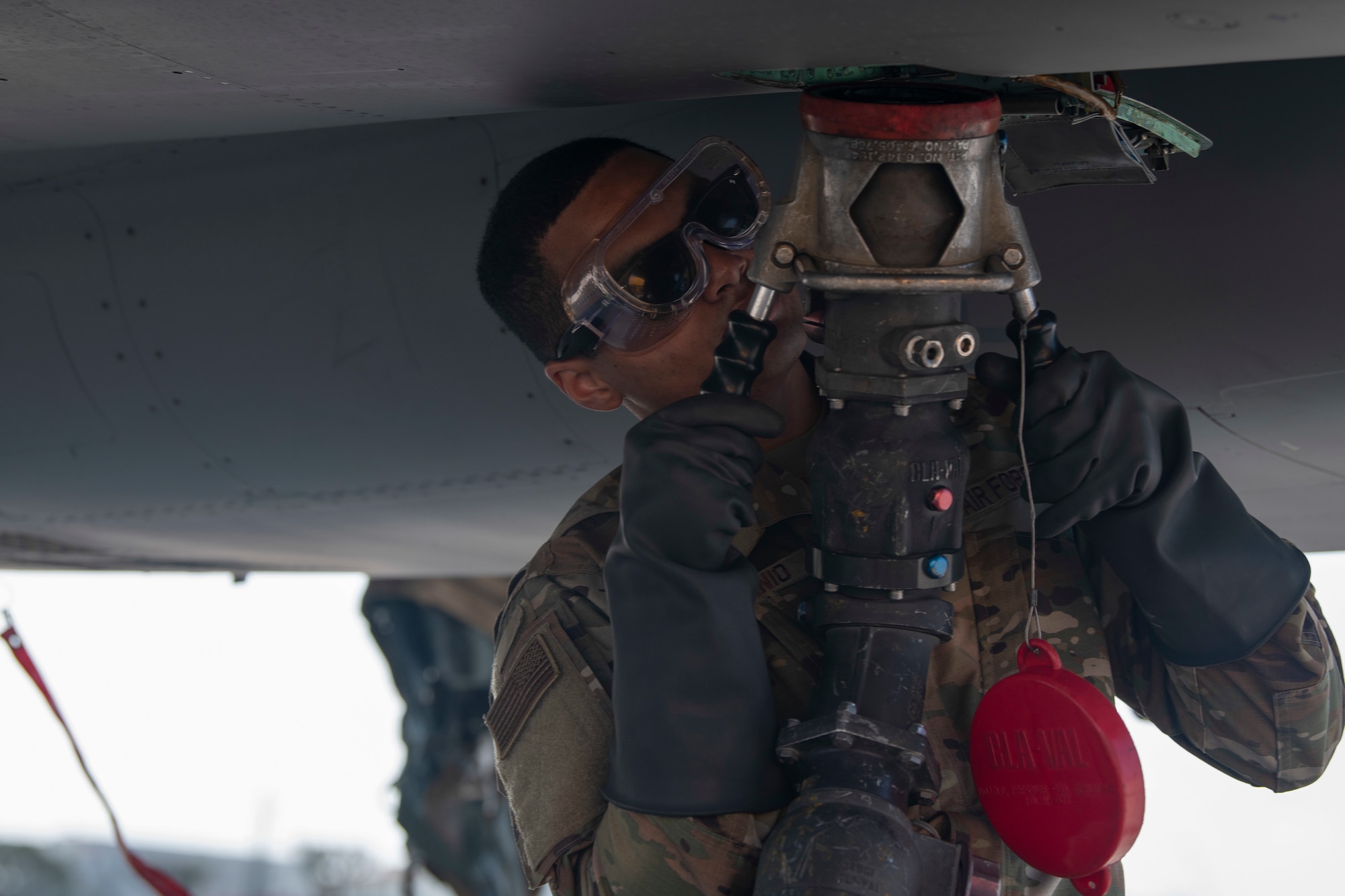 U.S. Air Force Senior Airman Elijah Terredanio, 44th Aircraft Maintenance Unit crew chief, refuels an F-15C Eagle, from Kadena Air Base, Japan, during an Agile Combat Employment exercise Feb. 21, 2020, at Marine Corps Air Station Futenma, Japan. Exercises that test our multi-capable Airmen and joint partners to provide munition loading and tactical refueling with minimal support are integral to employing precise ACE concept practices. (U.S. Air Force photo by Senior Airman Rhett Isbell)