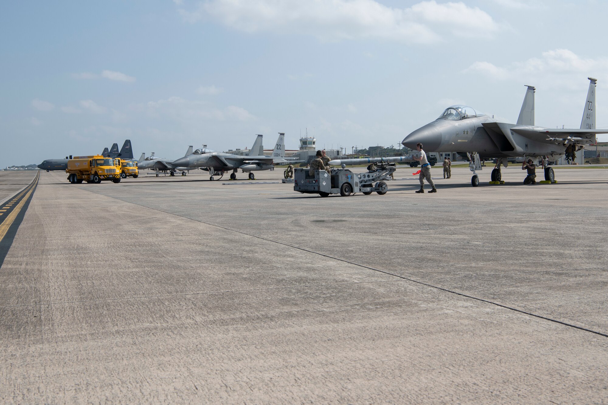 U.S. Air Force Airmen and U.S. Marines refuel and rearm F-15C Eagles, from Kadena Air Base, Japan, during an Agile Combat Employment exercise Feb. 21, 2020, at Marine Corps Air Station Futenma, Japan. Exercises that test our multi-capable Airmen and joint partners to provide munition loading and tactical refueling with minimal support are integral to employing precise ACE concept practices. (U.S. Air Force photo by Senior Airman Rhett Isbell)