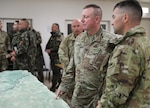 U.S. Army Col. Eric Riley, commander of the 41st Infantry Brigade Combat Team, consults Lt. Col. Kyle Akers, commander of the 2nd Battalion, 162nd Infantry Regiment, 41st Infantry Brigade Combat Team, Oregon Army National Guard, about the multinational training Exercise Jungleer Enterprise Feb.19, 2020, at the Joint Multinational Readiness Center in Hohenfels, Germany.