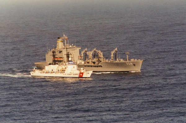 CGC CHASE underway with a Navy replenishment ship