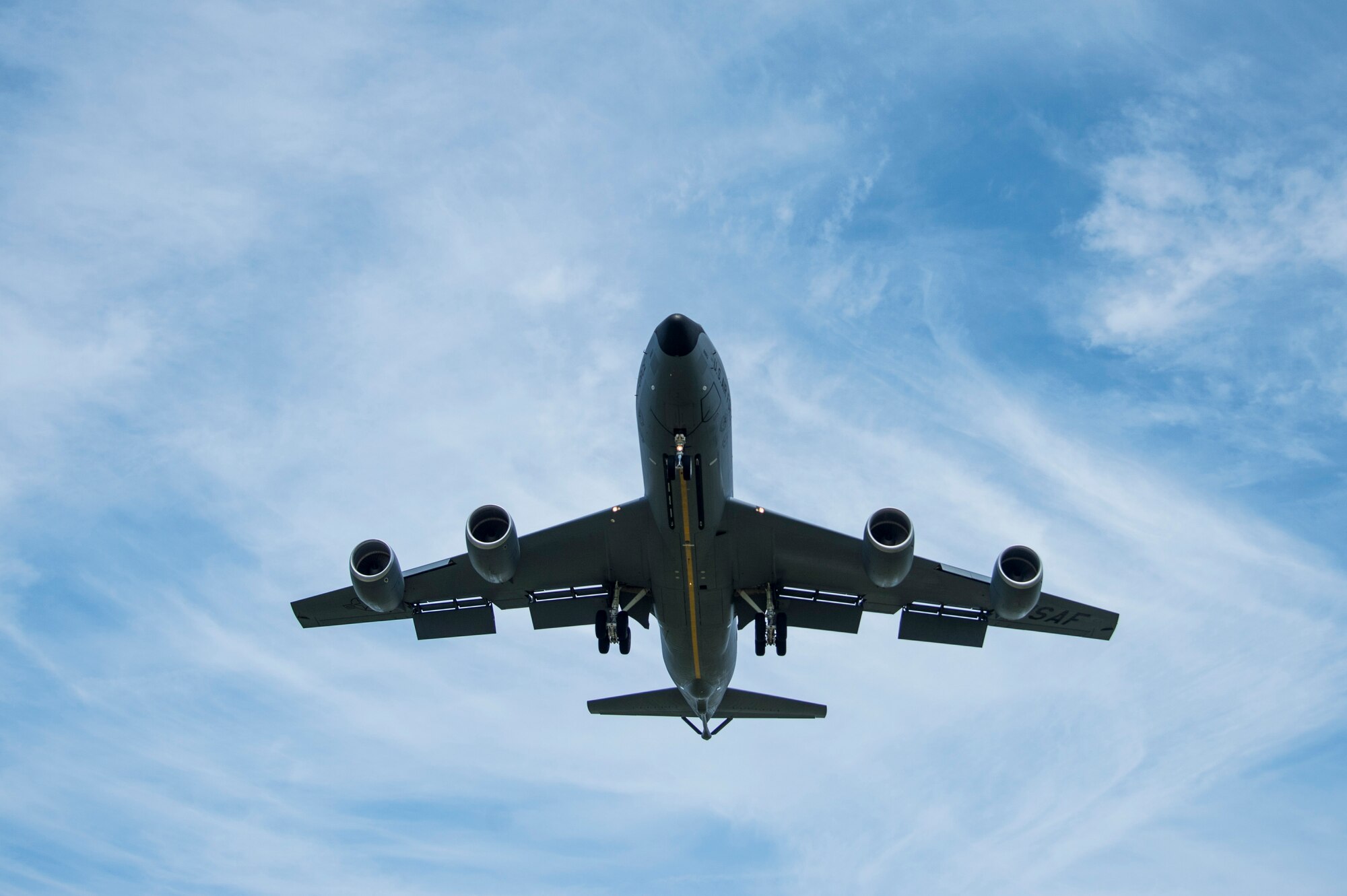 A KC-135 Stratotanker aircraft flies a runway approach at MacDill AFB, Florida.