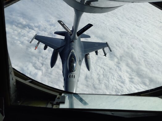 An F-16 Fighting Falcon aircraft is refueled by a KC-135 Stratotanker aircraft over Texas.