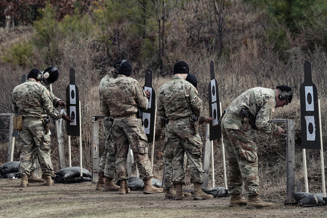 U.S. Army Soldiers participating in the Master Marksmanship Course Trainer program, check their targets for firing accuracy at Joint Base Langley-Eustis, Virginia, Jan. 27, 2020.