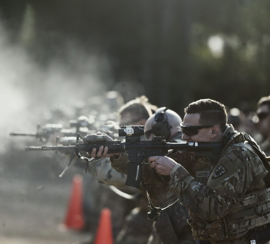 U.S. Army Sgt. Jacob Beardmore, 7th Transportation Brigade (Expeditionary), fires an M4 carbine during the Master Marksman Trainer Course at Joint Base Langley-Eustis, Virginia, Jan. 27, 2020.