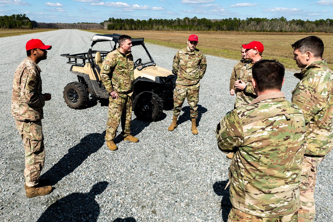 Photo of a commander speaking with Airmen.