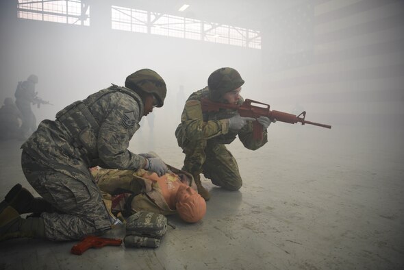 Airmen from the 14th Medical Group train with a medical training mannequin during the Tactical Combat Casualty Care Course in the Walker Center Feb. 23, 2020, on Columbus Air Force Base, Miss. TCCC has become the standard of medical training proficiency for military personnel to prepare them for potential combat situations in an ongoing effort to heighten medical readiness. (U.S. Air Force photo by Airman 1st Class Jake Jacobsen)