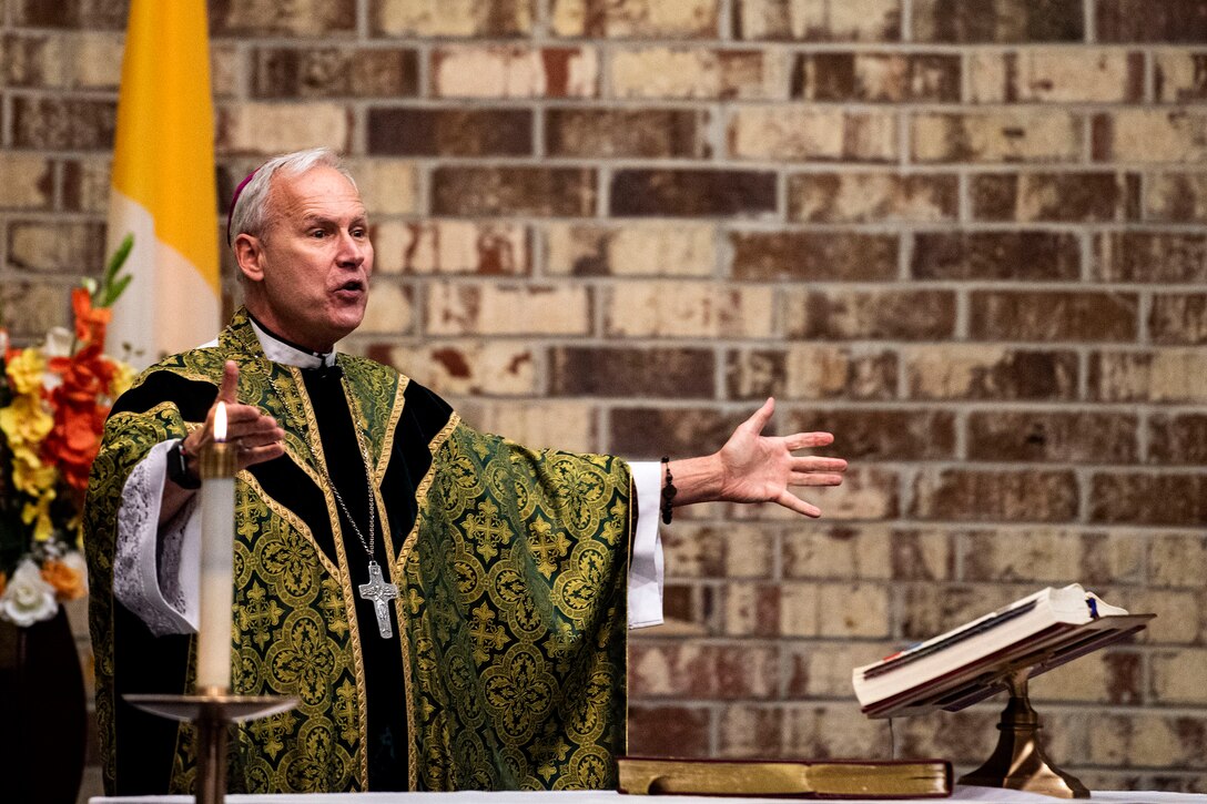 Photo of bishop greeting a congregation.
