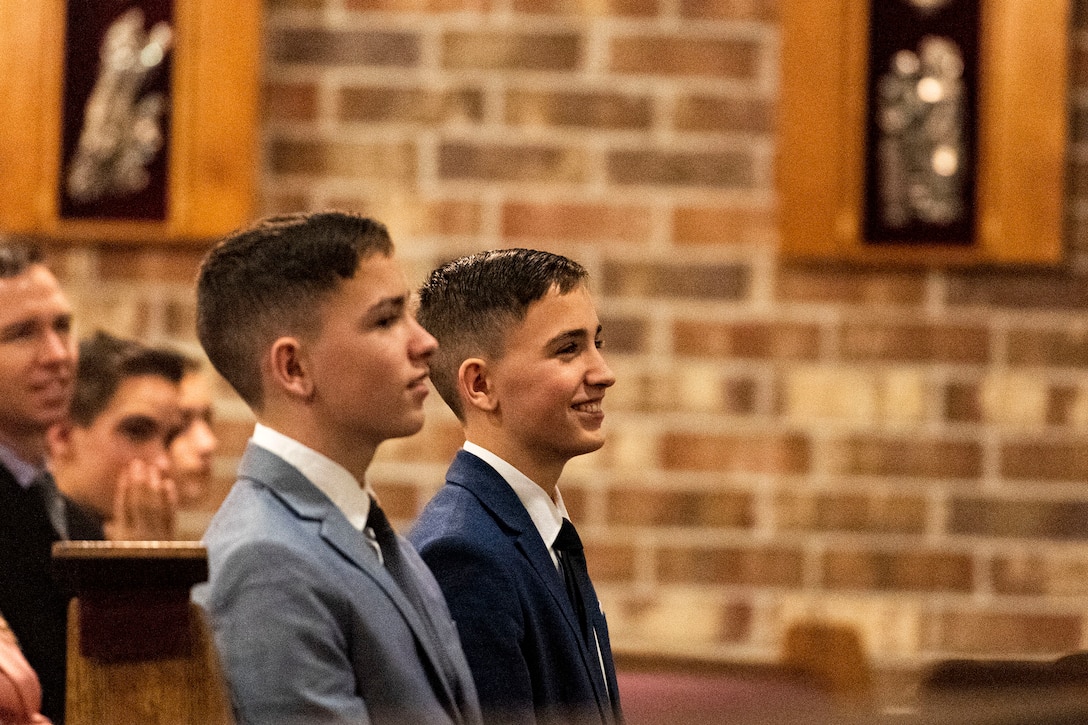 Photo of boys smiling during a church service.