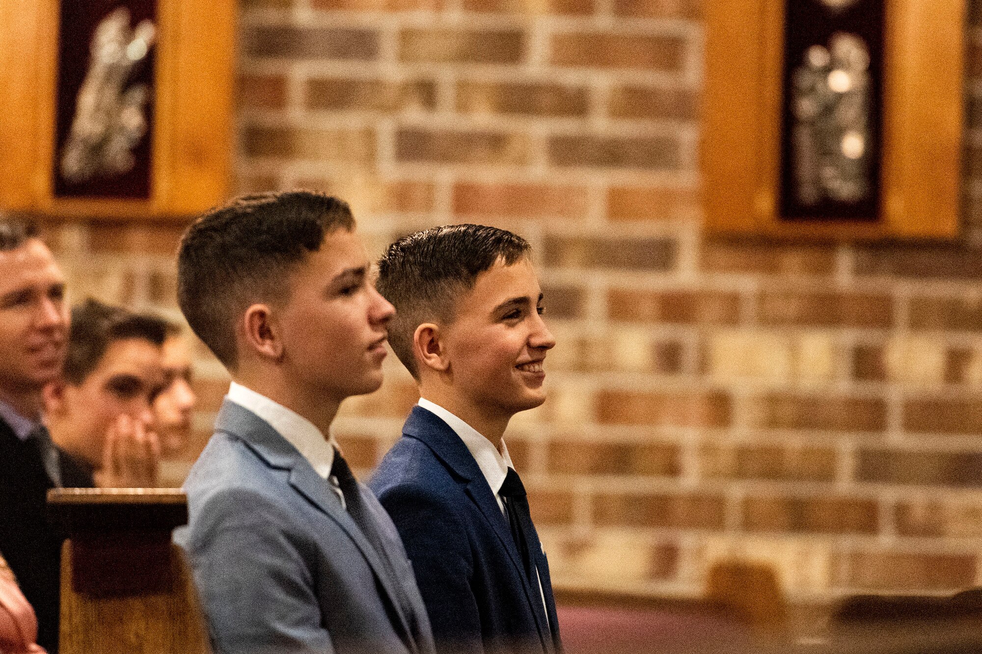 Photo of boys smiling during a church service.