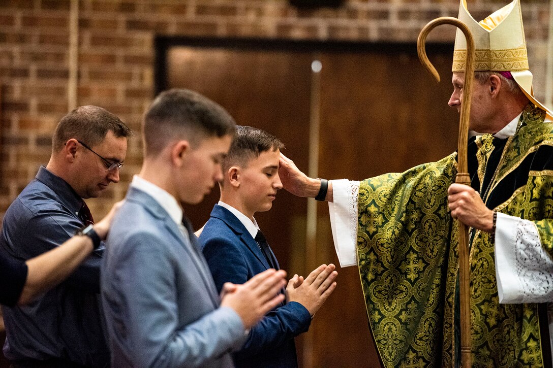 Photo of a child being anointed with holy chrism.