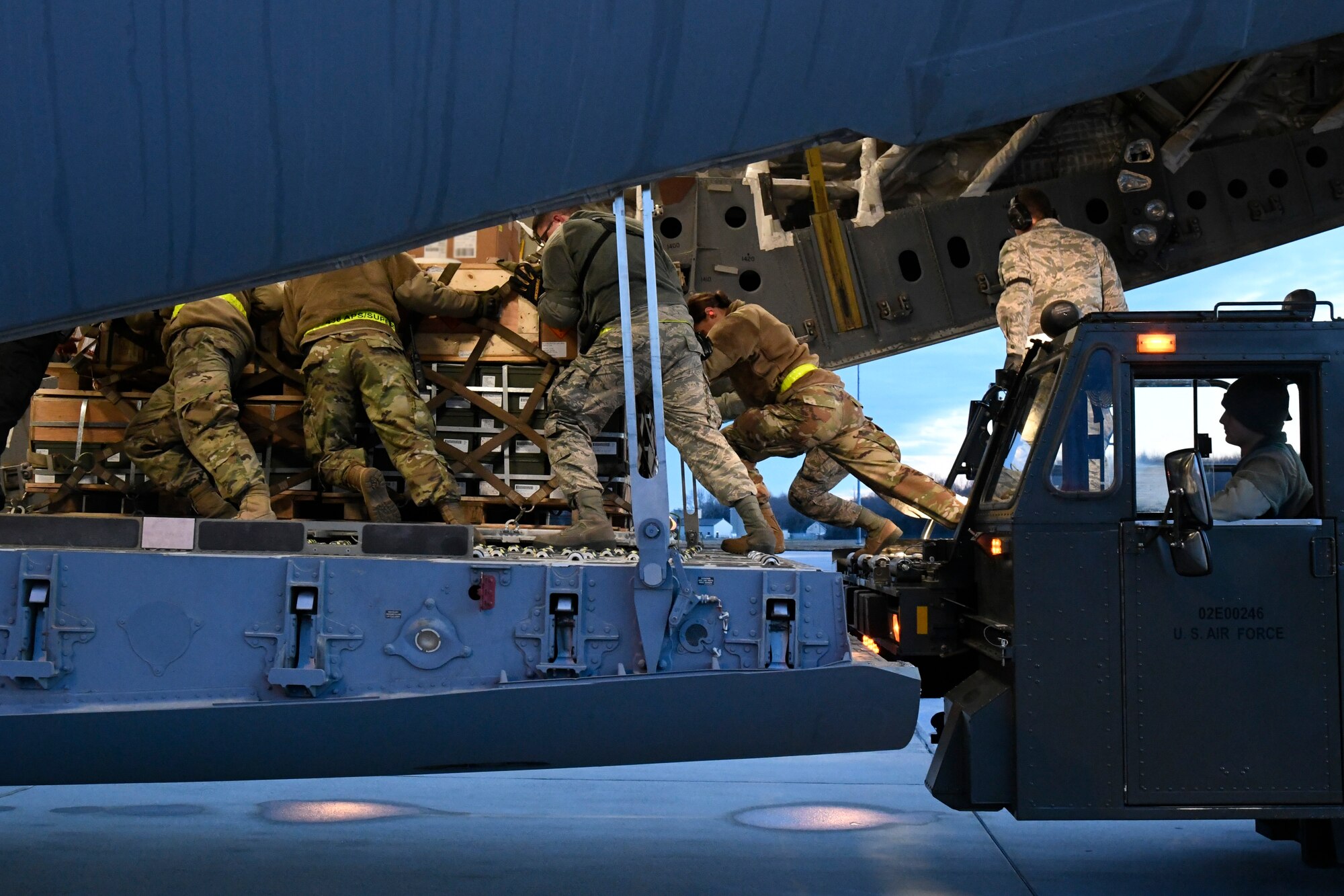 Airmen assigned to the 436th Aerial Port Squadron move cargo onto a United Arab Emirates (UAE) air force C-17 Globemaster III Jan. 26, 2020, at Dover Air Force Base, Del. The cargo, Patriot Advanced Capability 3 Missile Segment Enhanced missiles, were shipped to the UAE as part of a foreign military sales program. (U.S. Air Force photo by Senior Airman Eric M. Fisher)