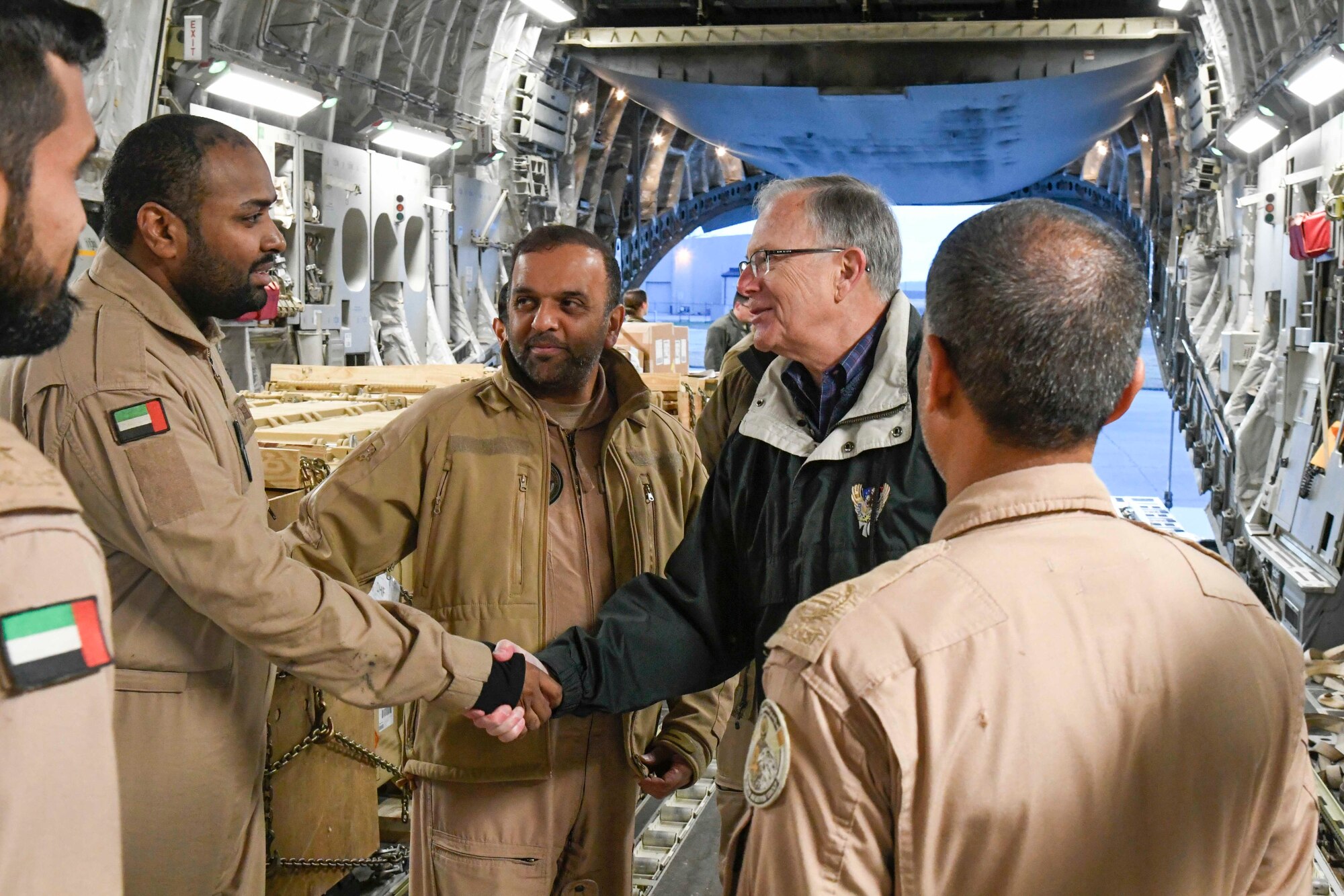 The Honorable Dr. Bruce D. Jette, assistant secretary of the Army (acquisition, logistics and technology), speaks with members of the United Arab Emirates air force 15th Strategic Airlift Squadron Jan. 26, 2020 at Dover Air Force Base, Del. Jette visited Dover to oversee a shipment of Patriot Advanced Capability 3 Missile Segment Enhanced missiles to the United Arab Emirates. (U.S. Air Force photo by Senior Airman Eric M. Fisher)