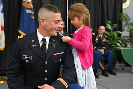 2nd Lt. Ted Baker, NHARNG, is pinned by his daughter, Norah, at a commissioning ceremony in Concord, Sept. 6, 2019.