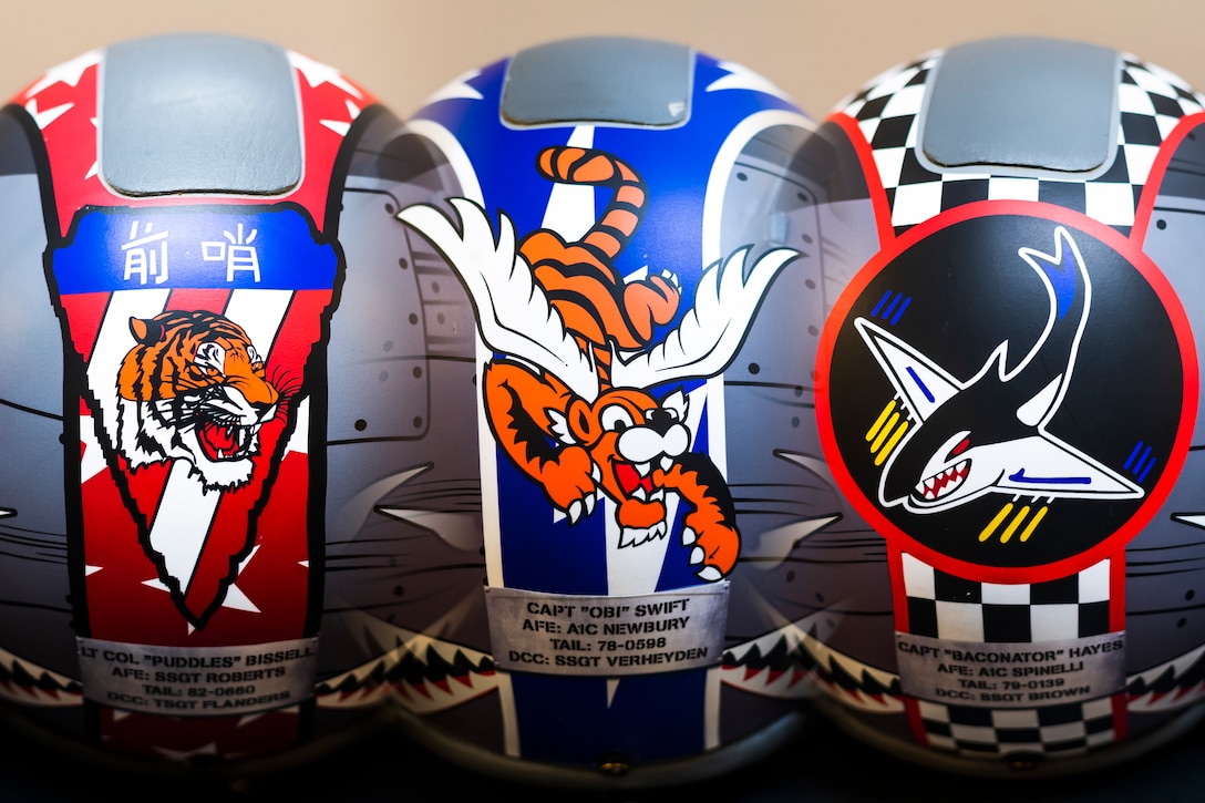 A photo illustration of three helmet wraps