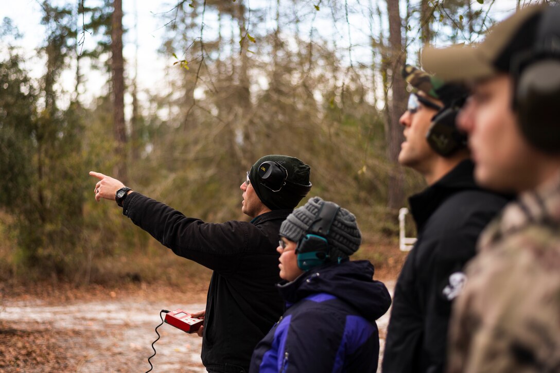 A photo of participants predicting the trajectory of a clay pigeon