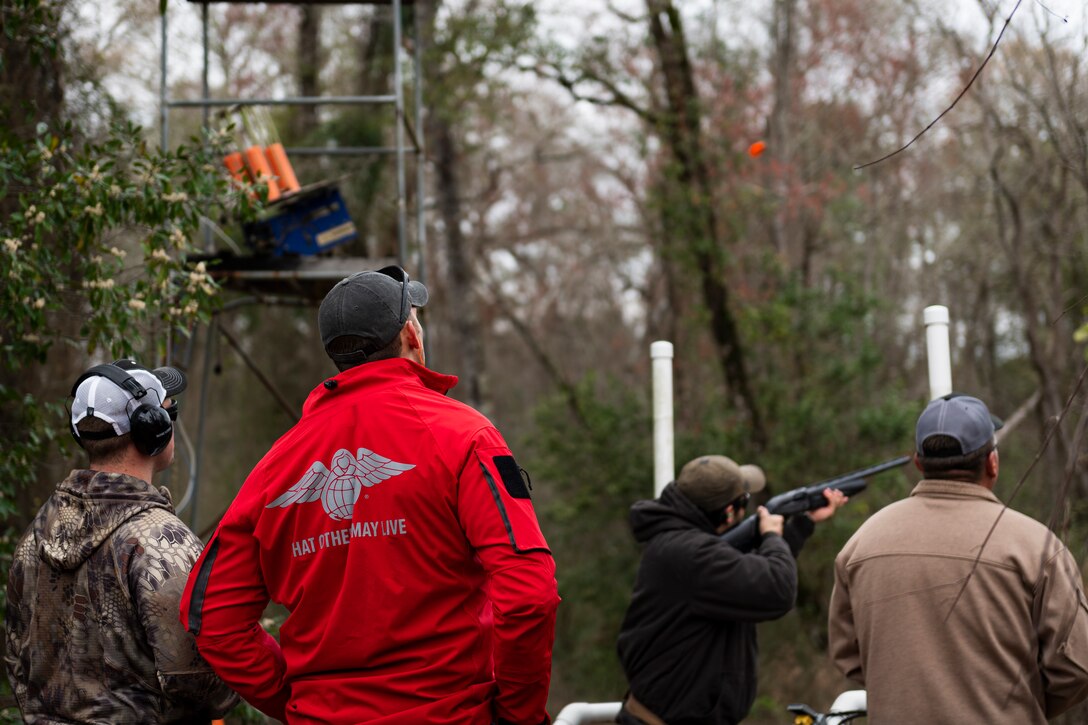 A photo of participants observing a sporting clay shoot