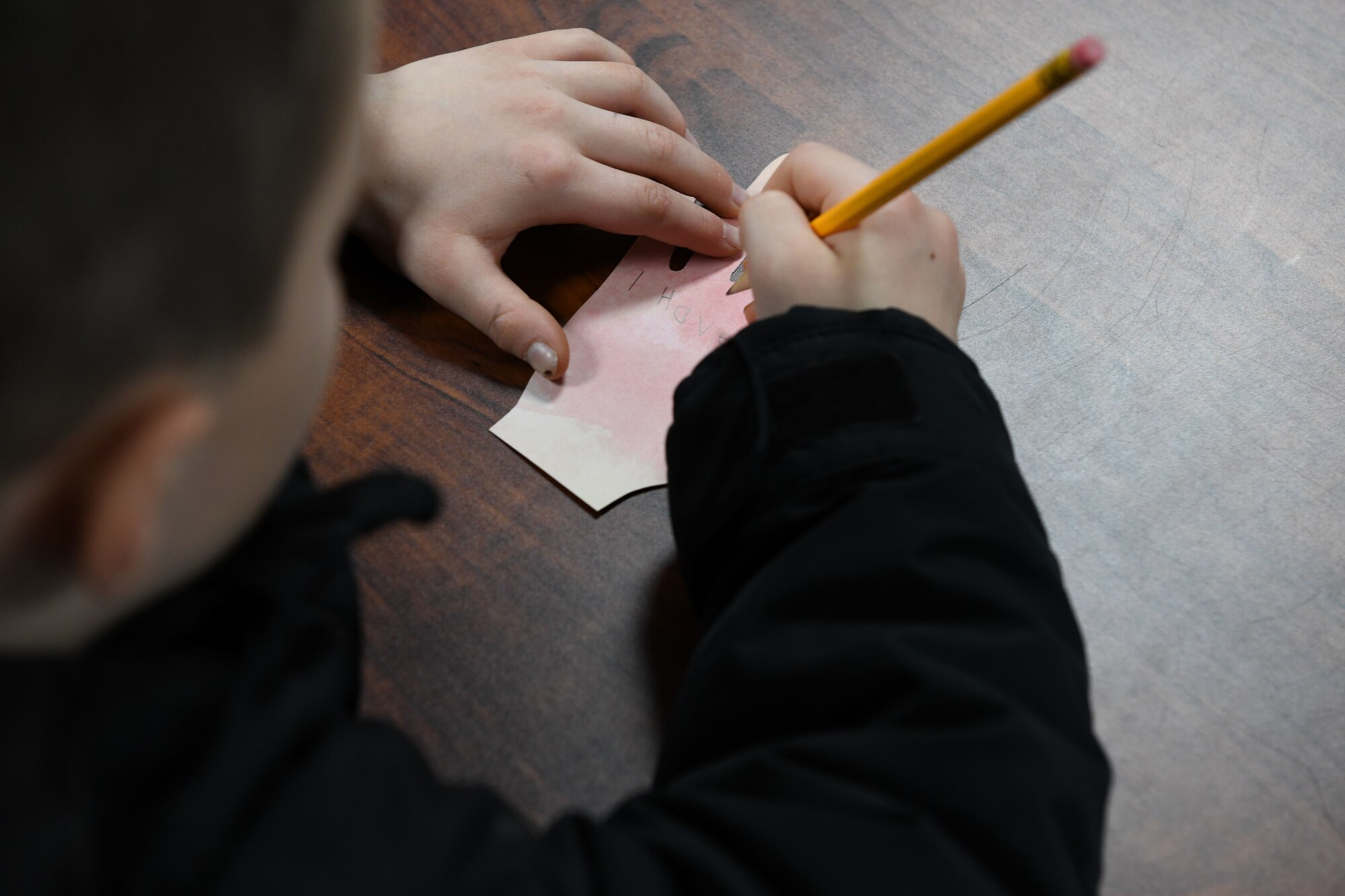 A child writes his dream on a paper hand during a Black History Month event at the Youth Center Feb. 12, 2020, at Malmstrom Air Force Base, Mont.
