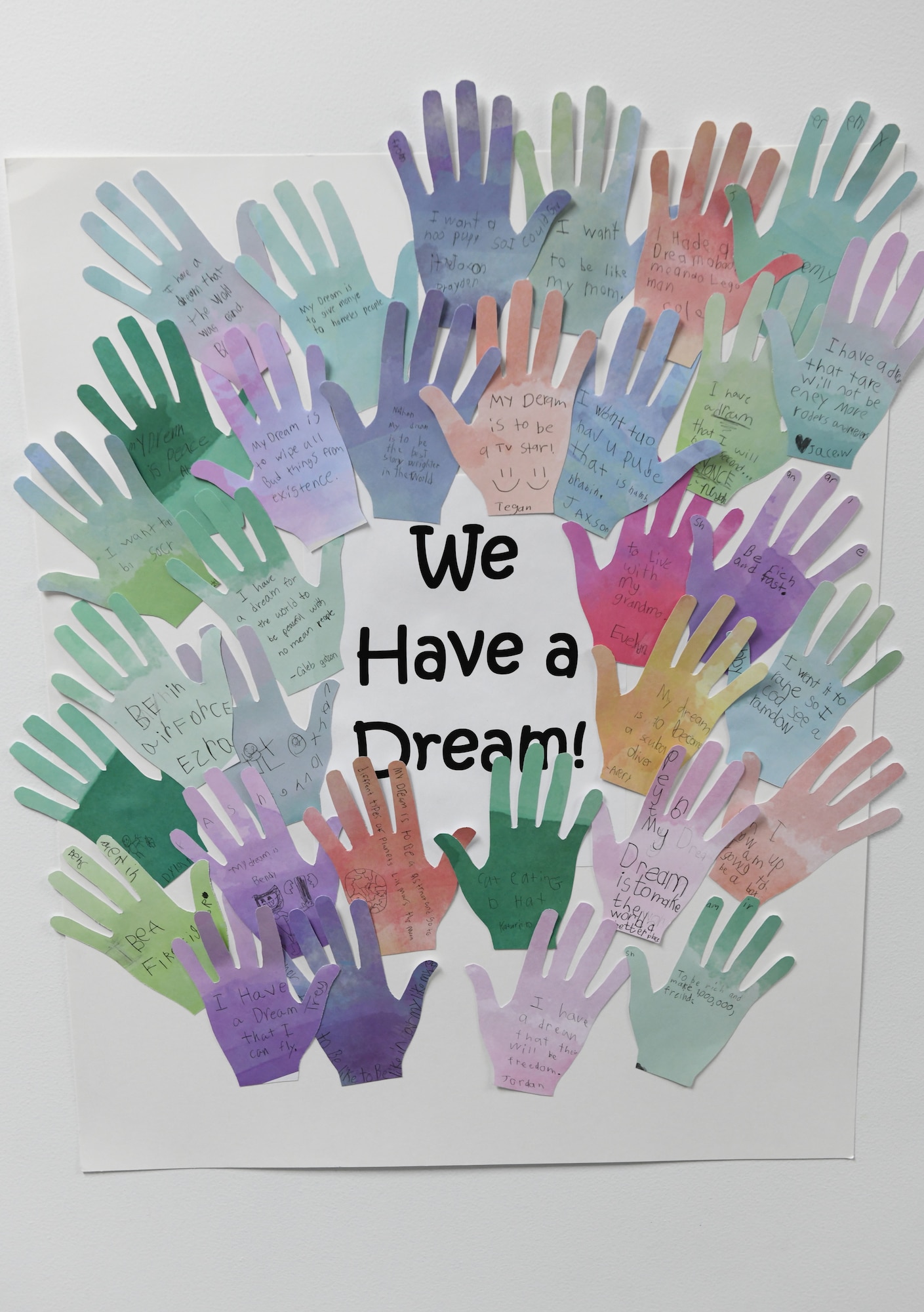 Children at the Youth Center write their dreams on paper hands to create a wall display during a Black History Month event at the Youth Center Feb. 12, 2020, at Malmstrom Air Force Base, Mont.
