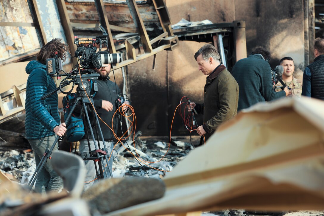 News crew sets up.
