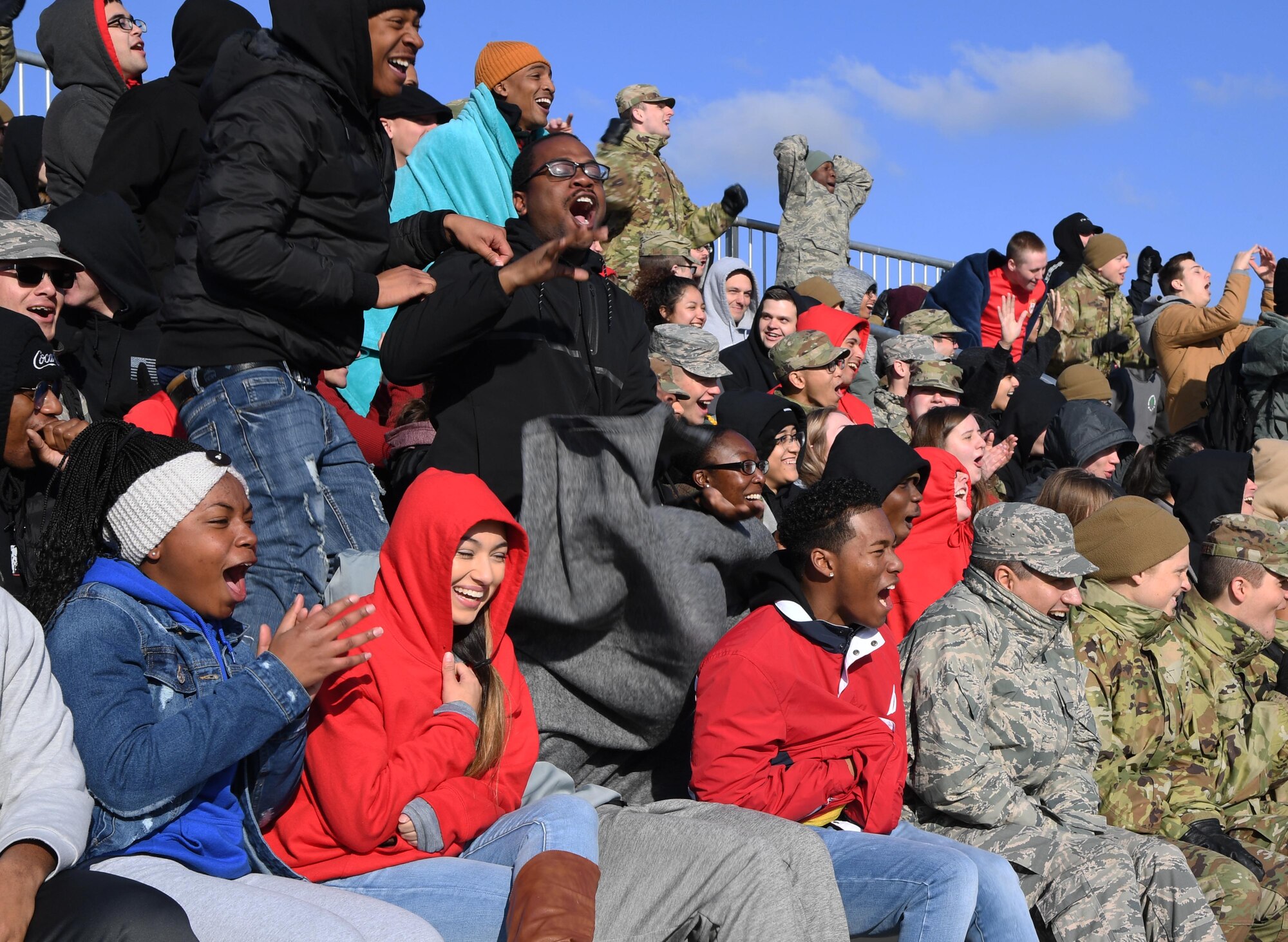 Airmen from the 336th Training Squadron cheer for their drill down teams during the 81st Training Group drill down on the Levitow Training Support Facility drill pad at Keesler Air Force Base, Mississippi, Feb. 21, 2020. Airmen from the 81st TRG competed in a quarterly open ranks inspection, regulation drill routine and freestyle drill routine. Keesler trains more than 30,000 students each year. While in training, Airmen are given the opportunity to volunteer to learn and execute drill down routines. (U.S. Air Force photo by Kemberly Groue)