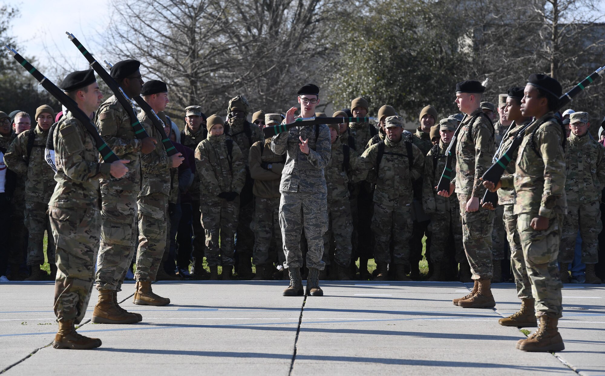Members of the 334th Training Squadron freestyle drill team perform during the 81st Training Group drill down on the Levitow Training Support Facility drill pad at Keesler Air Force Base, Mississippi, Feb. 21, 2020. Airmen from the 81st TRG competed in a quarterly open ranks inspection, regulation drill routine and freestyle drill routine. Keesler trains more than 30,000 students each year. While in training, Airmen are given the opportunity to volunteer to learn and execute drill down routines. (U.S. Air Force photo by Kemberly Groue)