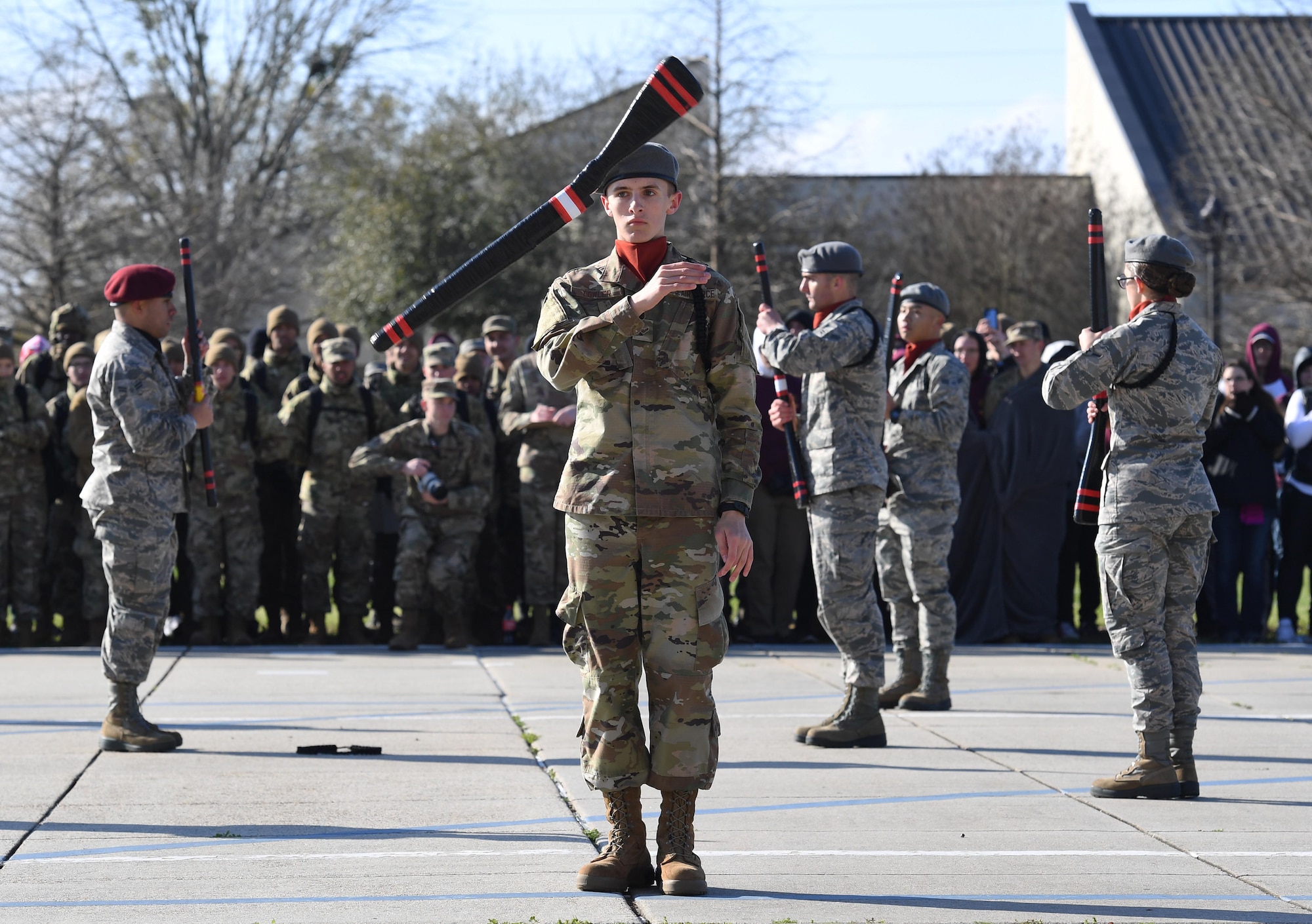 U.S. Air Force Airman 1st Class Ethan Fowler, 335th Training Squadron freestyle drill team member, performs during the 81st Training Group drill down on the Levitow Training Support Facility drill pad at Keesler Air Force Base, Mississippi, Feb. 21, 2020. Airmen from the 81st TRG competed in a quarterly open ranks inspection, regulation drill routine and freestyle drill routine. Keesler trains more than 30,000 students each year. While in training, Airmen are given the opportunity to volunteer to learn and execute drill down routines. (U.S. Air Force photo by Kemberly Groue)