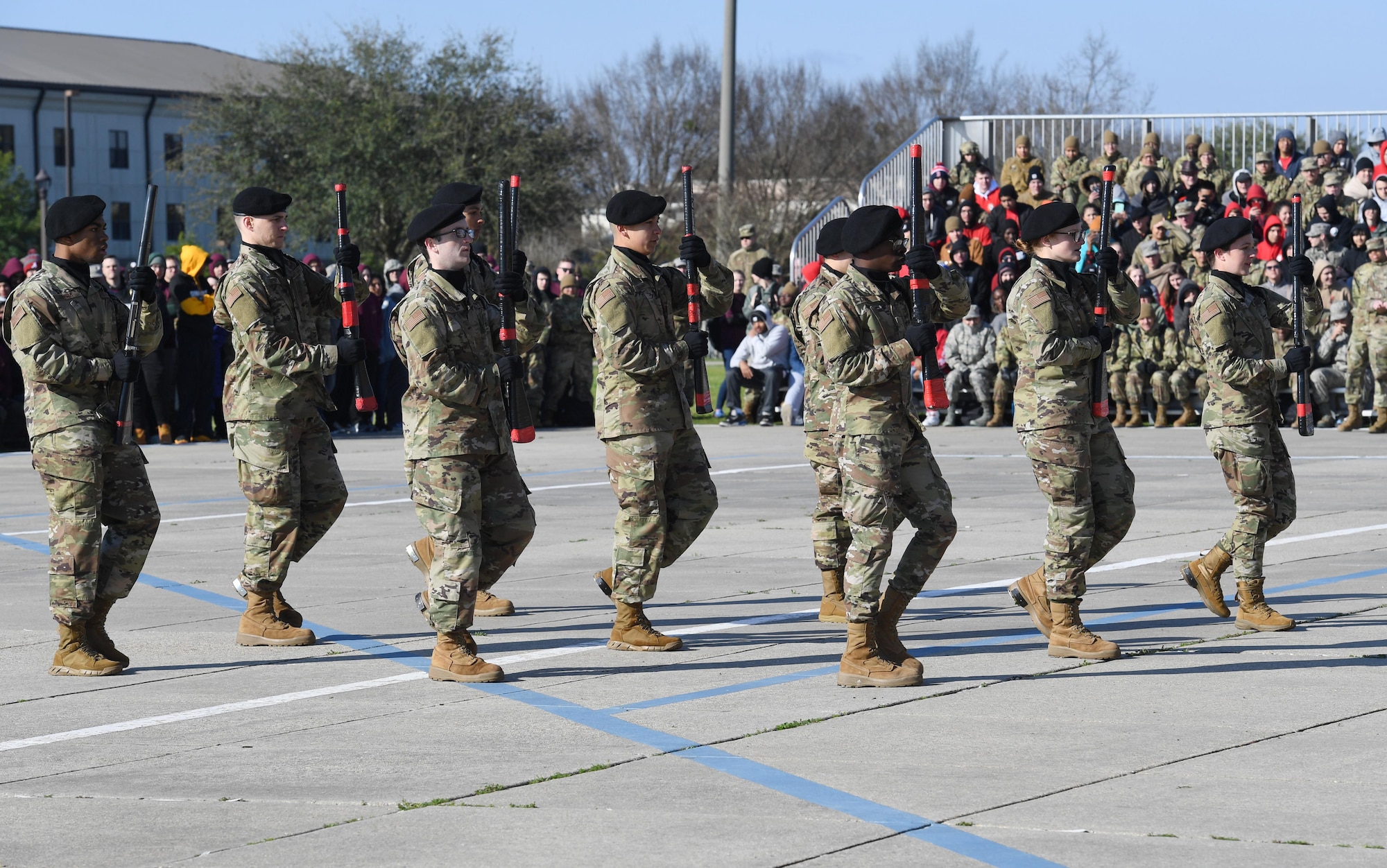 Members of the 336th Training Squadron freestyle drill team perform during the 81st Training Group drill down on the Levitow Training Support Facility drill pad at Keesler Air Force Base, Mississippi, Feb. 21, 2020. Airmen from the 81st TRG competed in a quarterly open ranks inspection, regulation drill routine and freestyle drill routine. Keesler trains more than 30,000 students each year. While in training, Airmen are given the opportunity to volunteer to learn and execute drill down routines. (U.S. Air Force photo by Kemberly Groue)